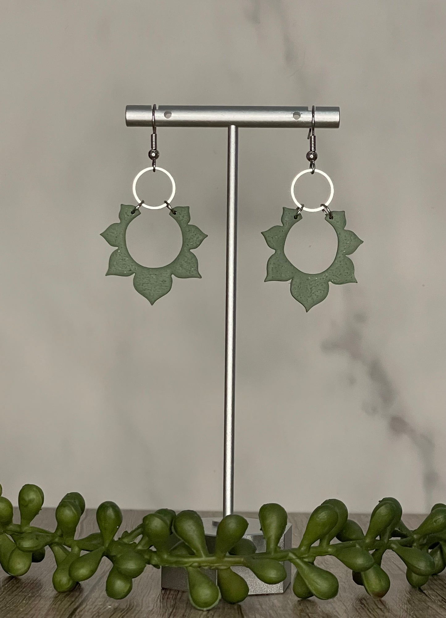 Sage green sunburst dangle earrings