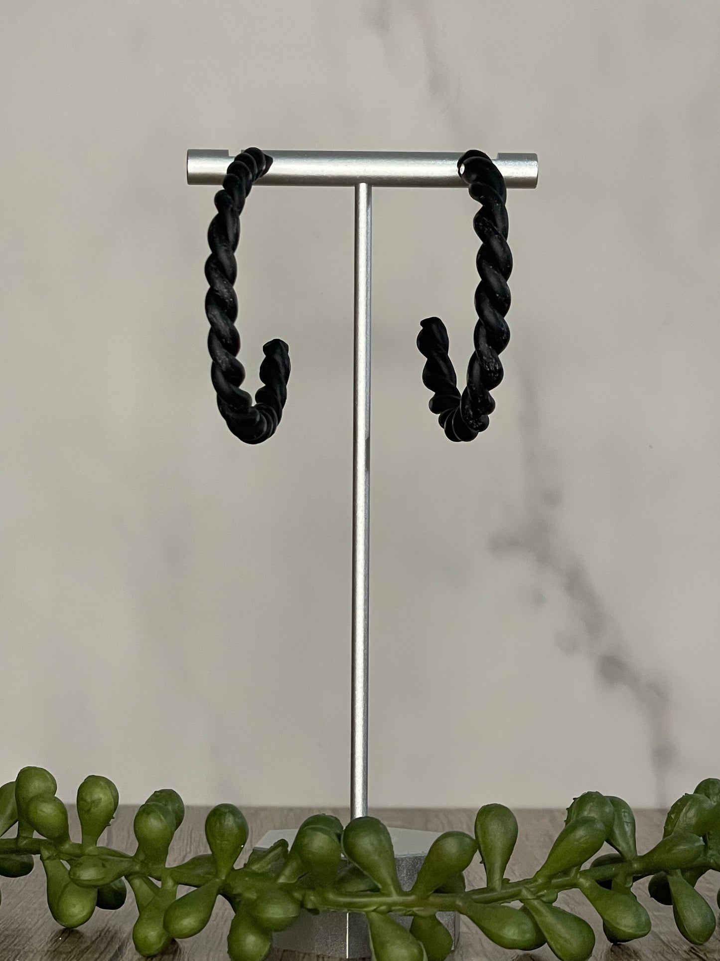 Twisted classic black hoop earrings