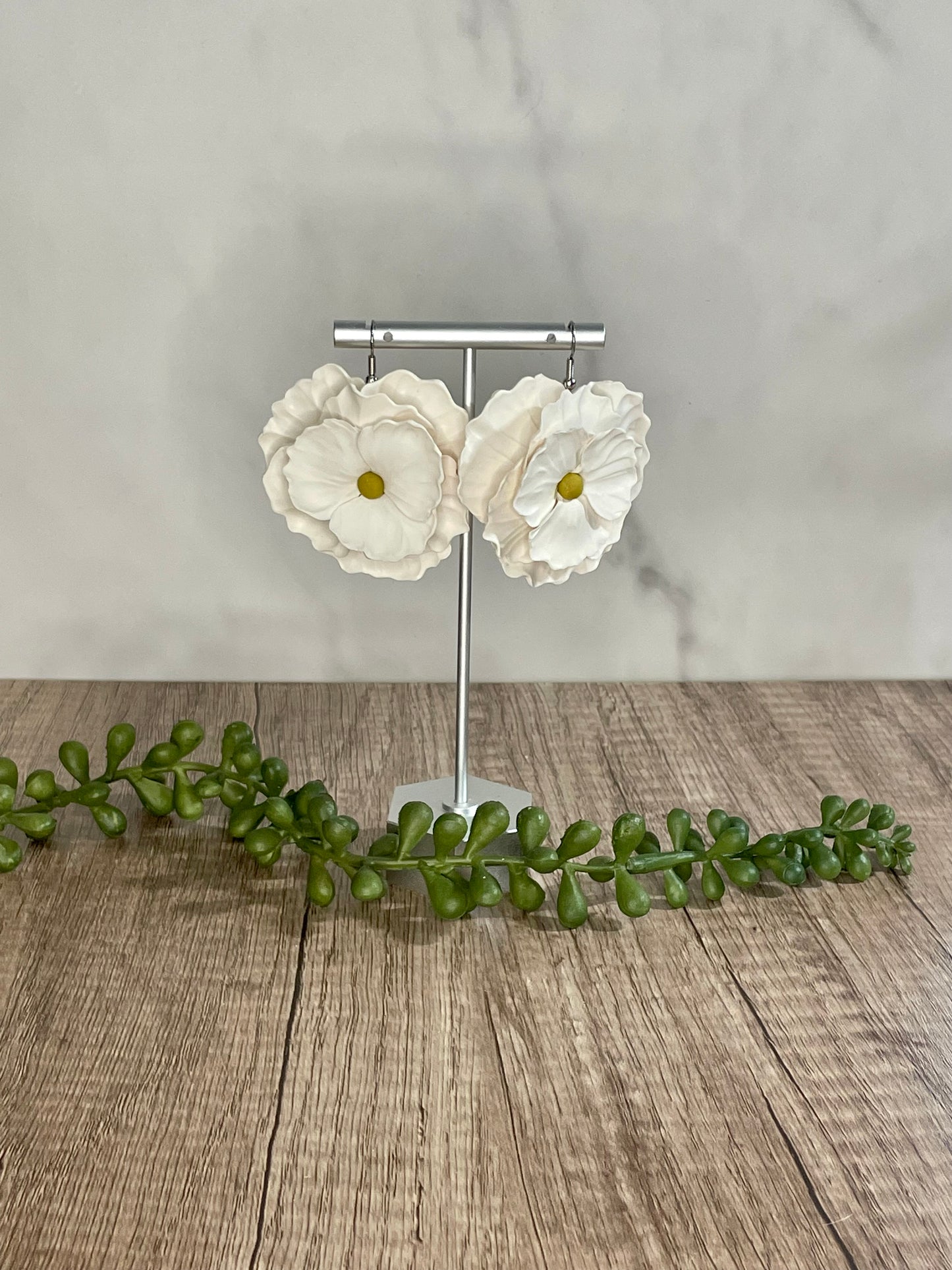 Sculpted flower dangle earrings