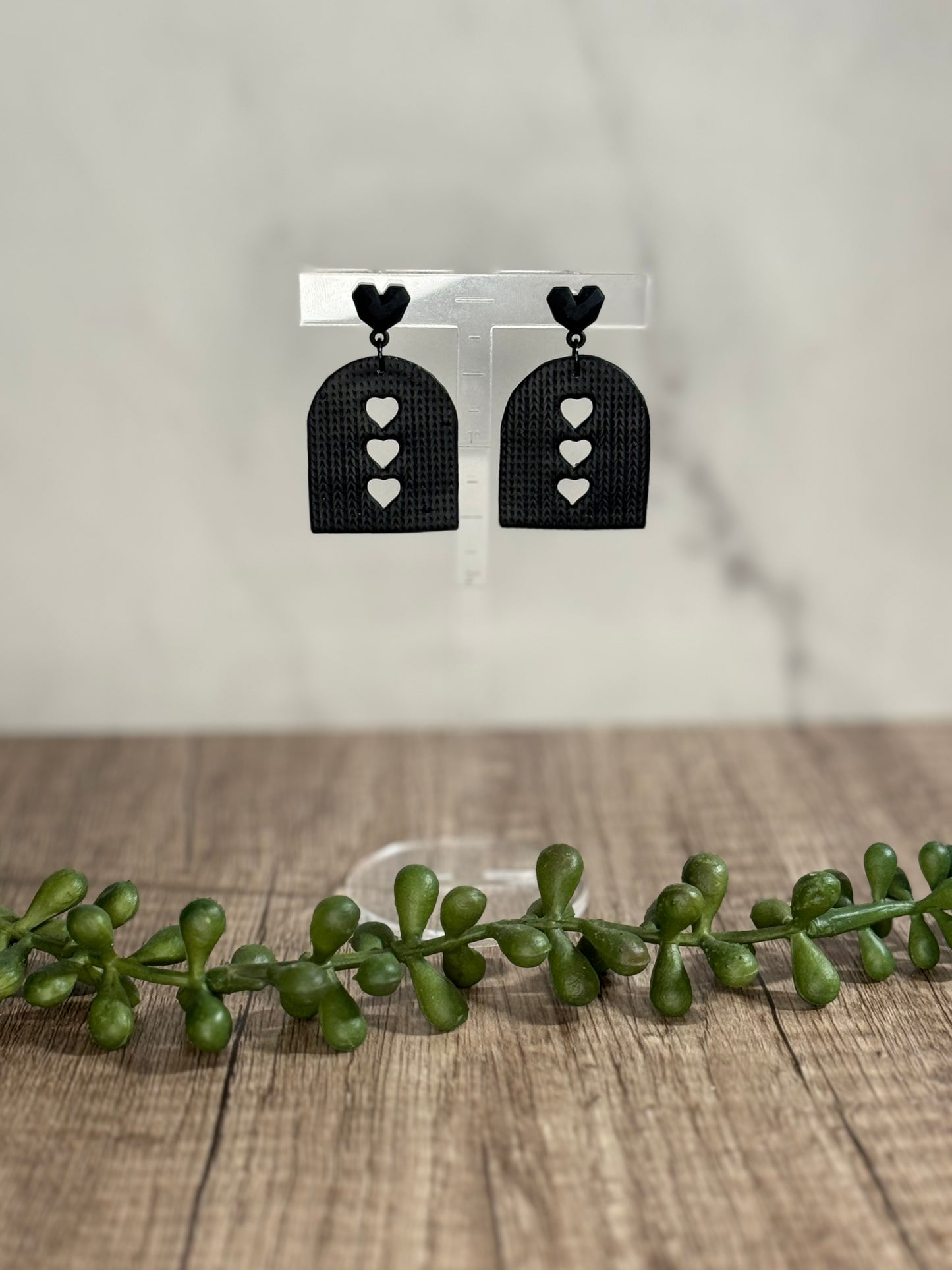 Black heart cutout stud earrings