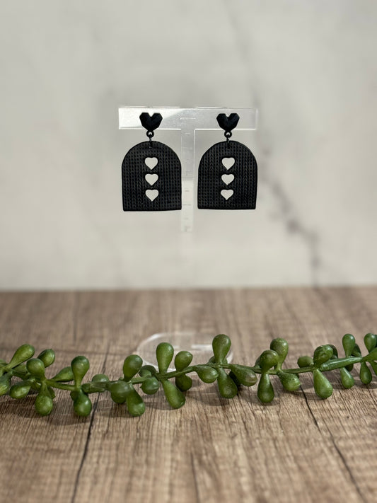 Black heart cutout stud earrings