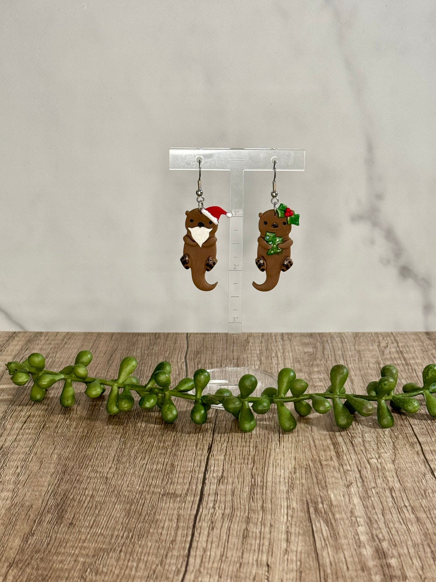 Christmas Otter dangle earrings