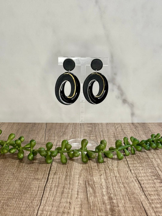 Black peep-through swirl stud earrings