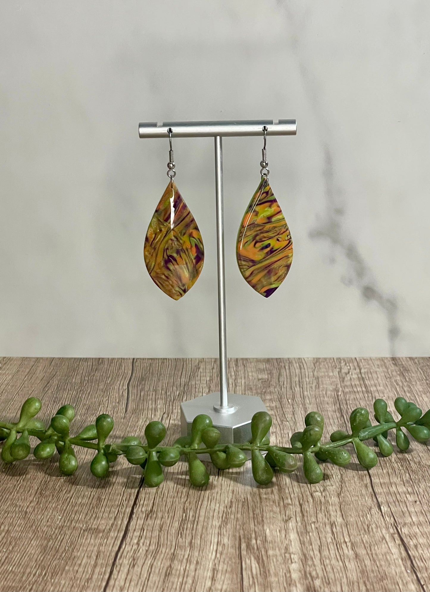 Green, orange, and purple marbled earrings